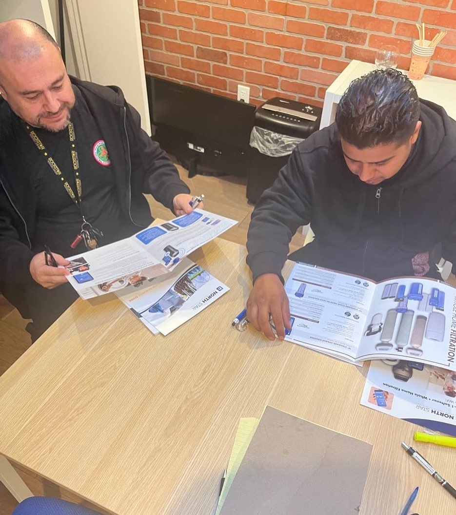 Flow Masters Plumbing technicians planning for a whole house filtration project for a customer.