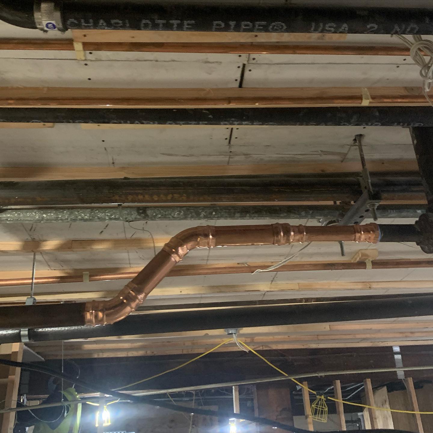 Recently repaired copper pipes in a basement
