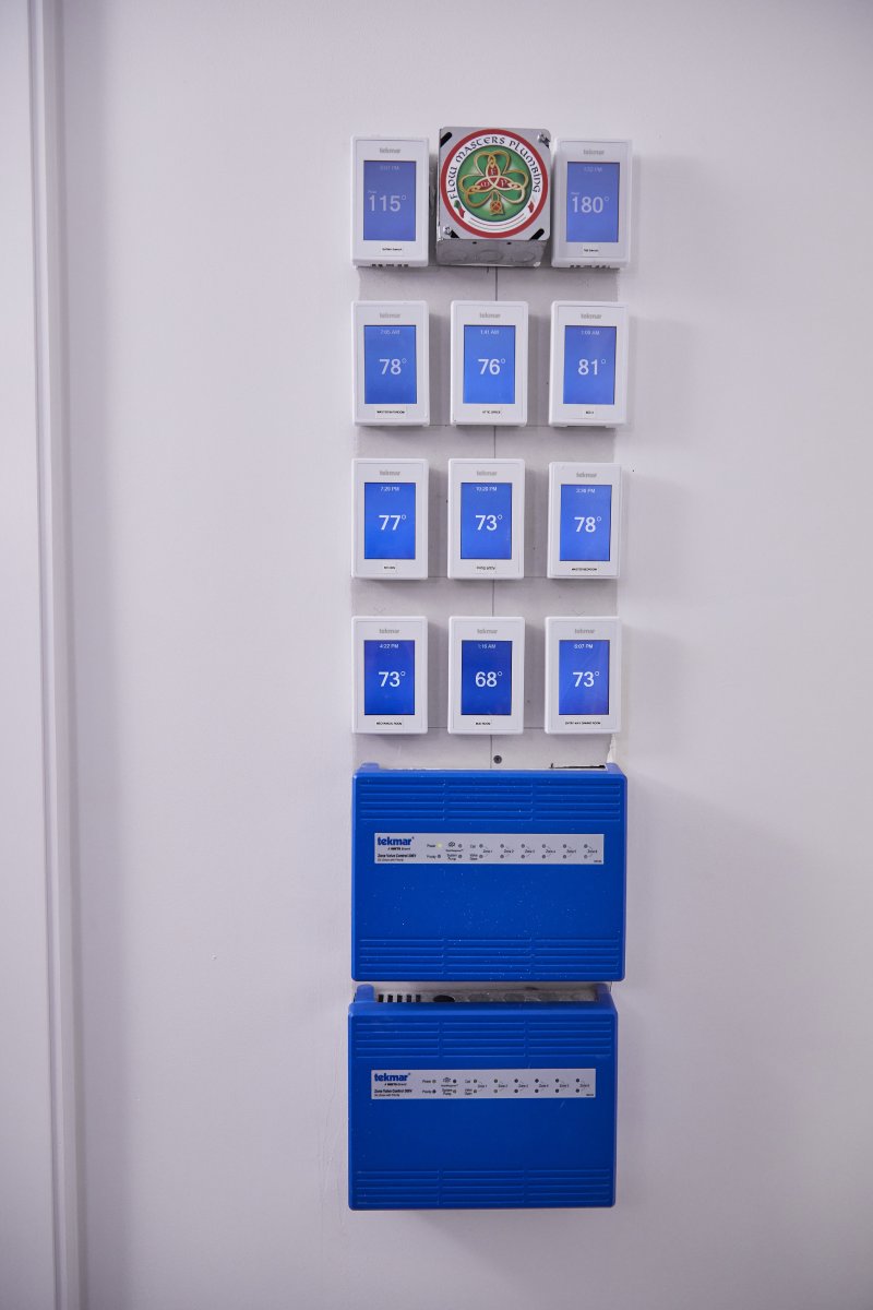 Wall-mounted thermostats installed.