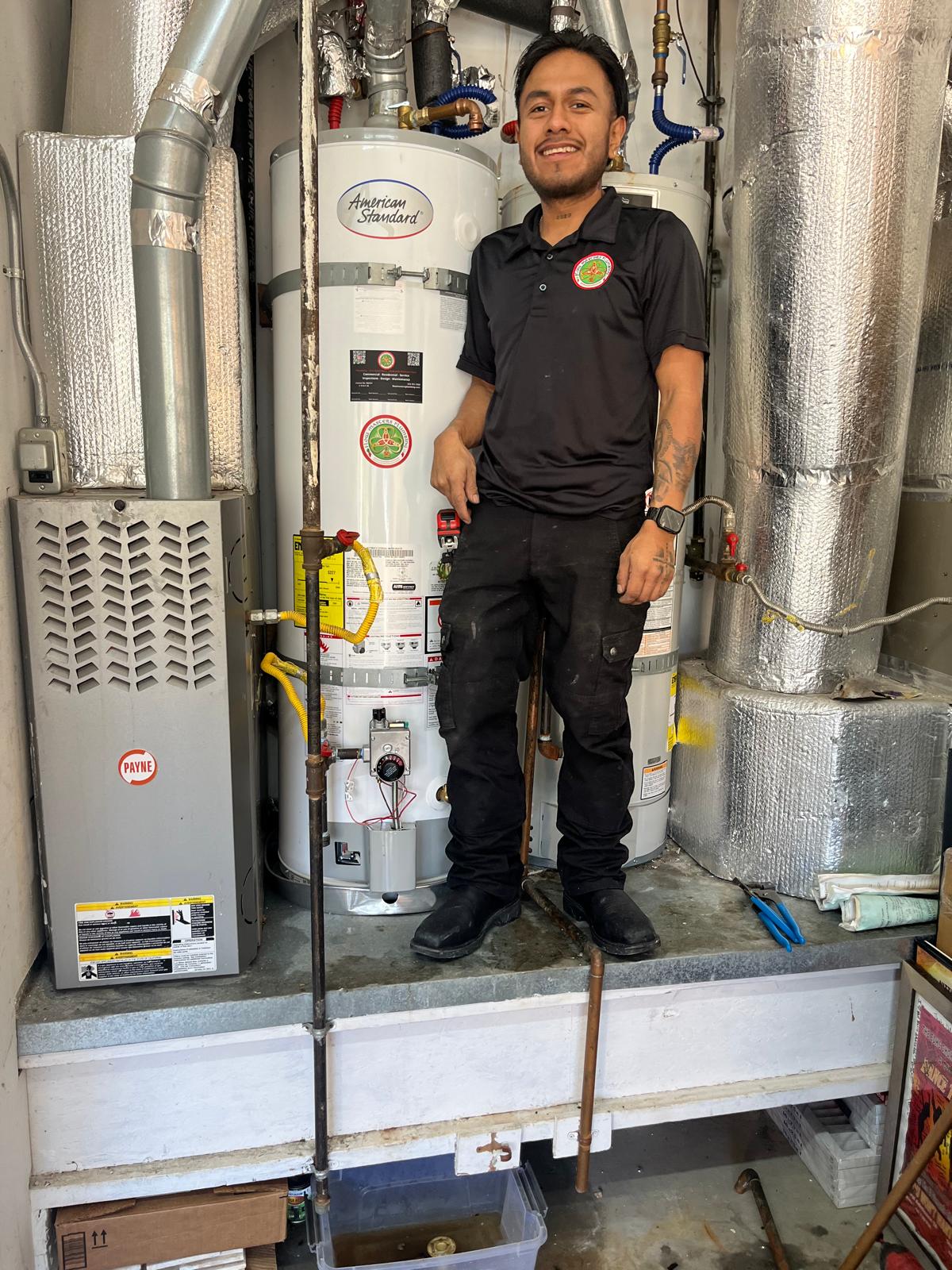 A Flow Masters’ plumber finishing up a water heater replacement.