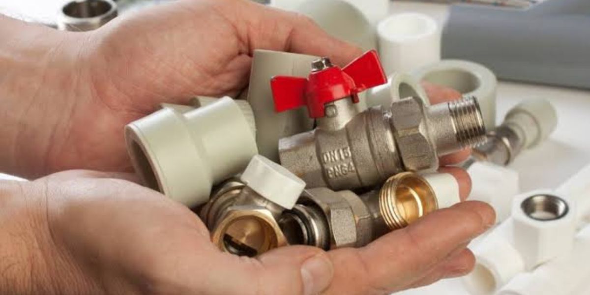 Plumber inspecting corroded faucets and plumbing fixtures affected by salty coastal air and moisture in a residential home | How Salt Air Affects Plumbing Fixtures